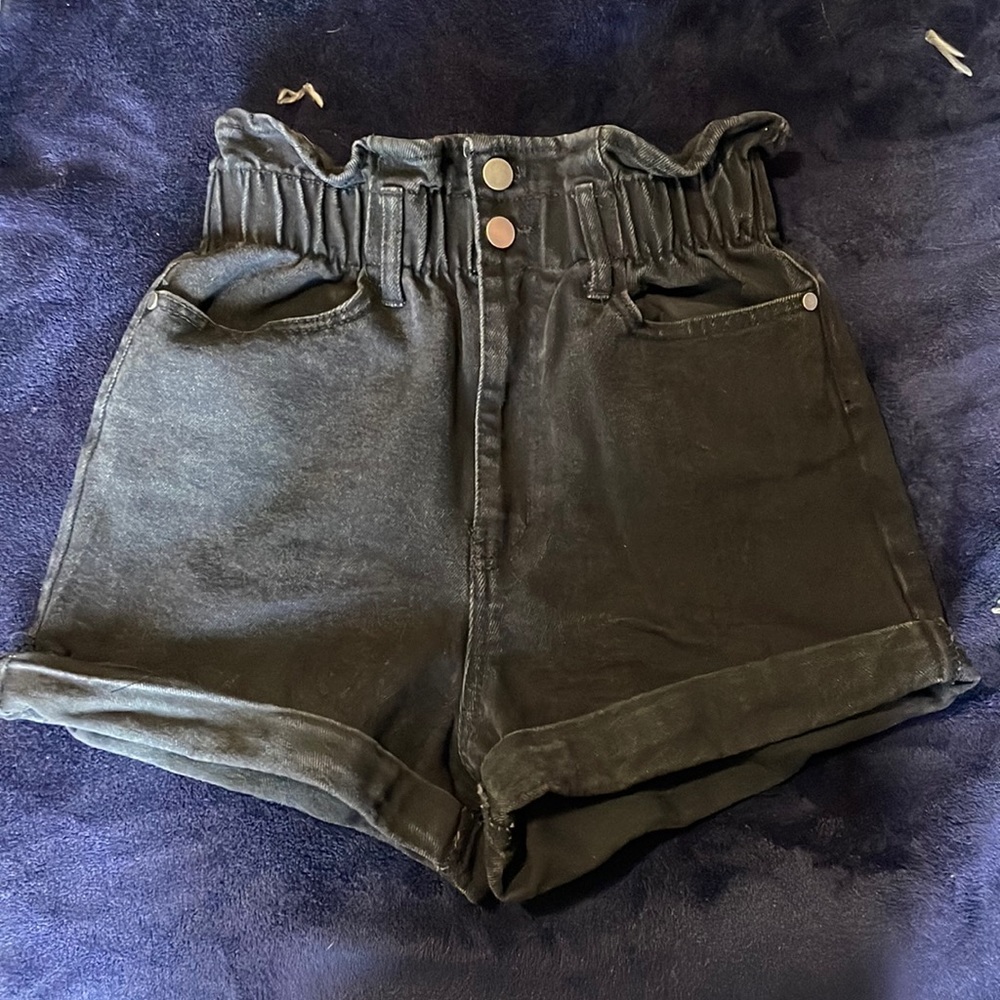 Black shorts with a scrunch around the waist.
